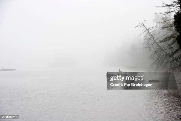 canoeing in the mist - isle royale national park stock pictures, royalty-free photos & images