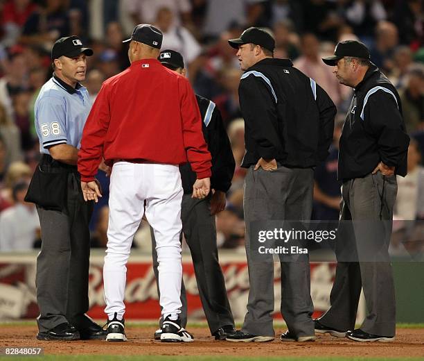 Manager Terry Francona of the Boston Red Sox talks with home plate umpire Dan Iassogna during the MLB game against the Tampa Bay Rays on September...