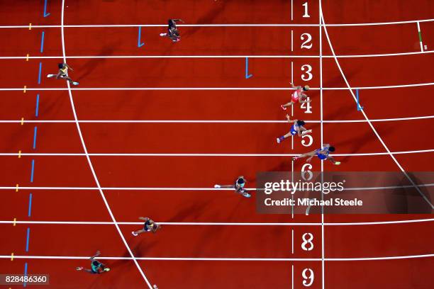 Phyllis Francis of the United States, Salwa Eid Naser of Bahrain and Allyson Felix of the United States cross the finish line ahead of Shaunae...