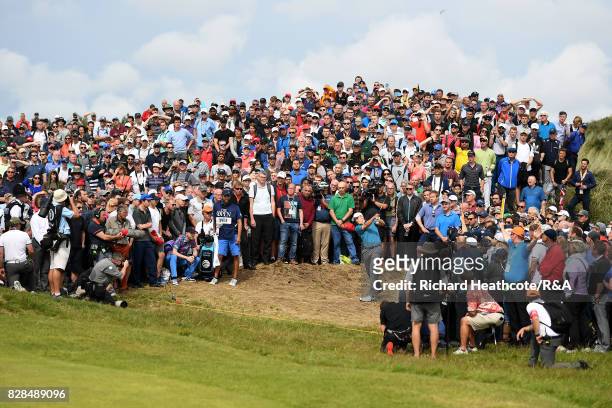 Jordan Spieth of the United States plays from the crowd on the 6th hole during the final round of the 146th Open Championship at Royal Birkdale on...