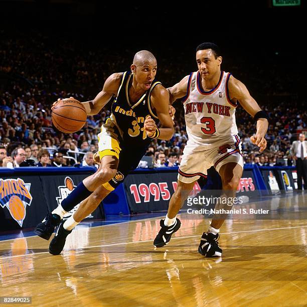 Reggie Miller of the Indiana Pacers drives to the basket against John Starks of the New York Knicks in Game Seven of the 1995 Eastern Conference...