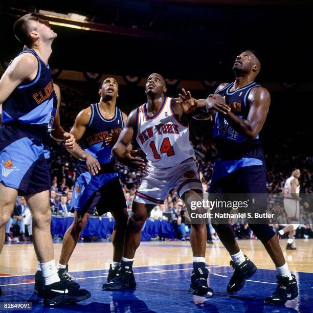 Anthony Mason of the New York Knicks boxes out against Michael Cage of the Cleveland Cavaliers in Game One of the 1995 Eastern Conference...