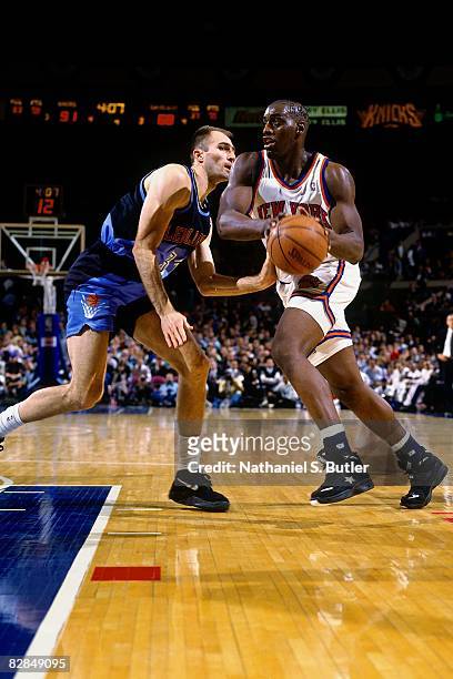 Anthony Mason of the New York Knicks drives to the basket against Danny Ferry of the Cleveland Cavaliers in Game One of the 1995 Eastern Conference...