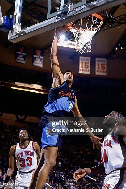 John "Hot Rod" Williams of the Cleveland Cavaliers dunks against Anthony Mason of the New York Knicks in Game One of the 1995 Eastern Conference...