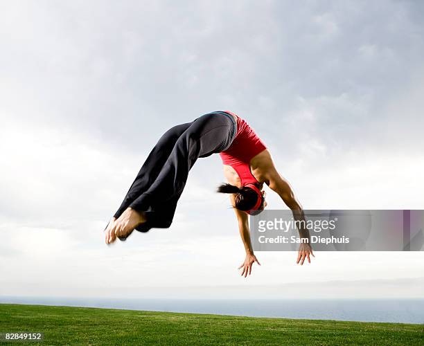 acrobats and contortionists - akrobatik stock-fotos und bilder