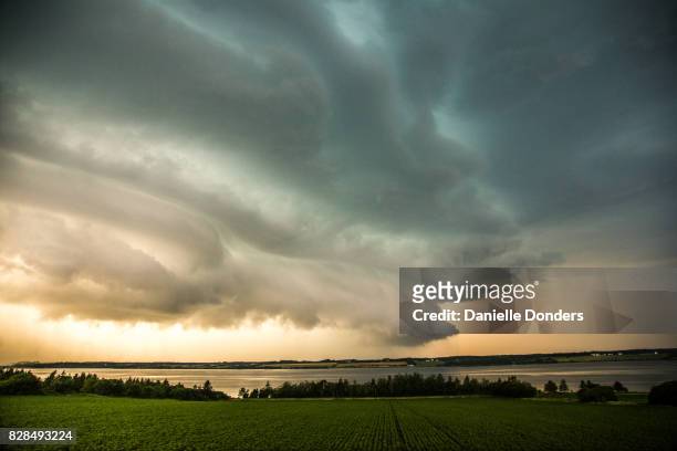 thunderstorm clouds over st peters bay, pei - danielle donders fotografías e imágenes de stock