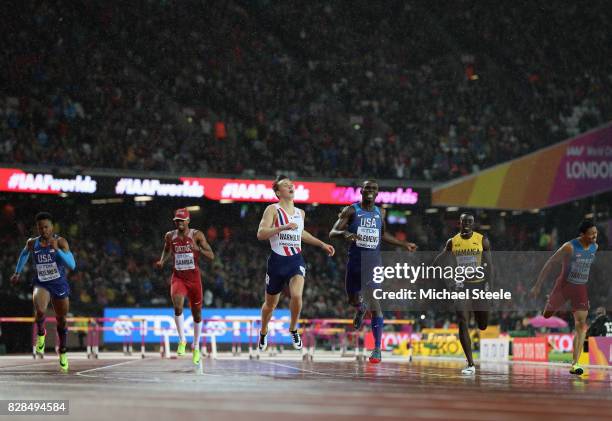 Karsten Warholm of Norway and Kerron Clement of the United States cross the finish line in the Men's 400 metres hurdles during day six of the 16th...