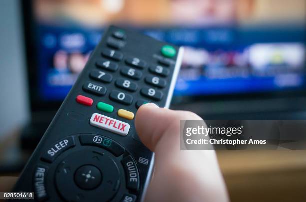 tv remote control with netflix button - netflix stock pictures, royalty-free photos & images