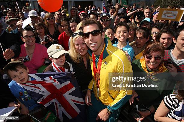 Swimmer Grant Hackett poses with fans during a welcome home parade for the Beijing 2008 Olympic Athletes at Federation Square on September 17, 2008...