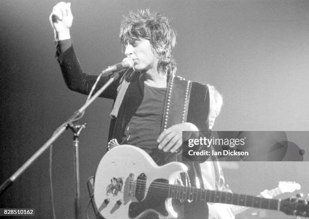 Johnny Thunders performing on stage at Lyceum Theatre, London 9 October 1983.