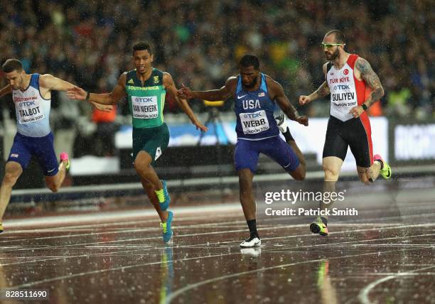 Wayde van Niekerk of South Africa, Ameer Webb of the United States and Ramiyl Guliyev of Turkey compete in the Men's 200 metres semi finals during...