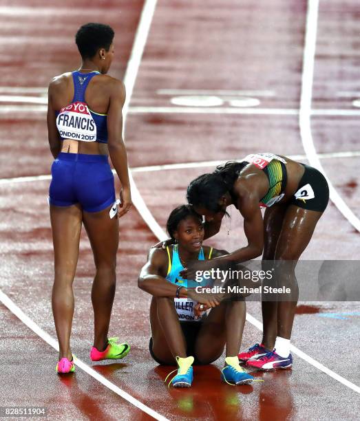 Phyllis Francis of the United States, Novlene Williams-Mills of Jamaica and Shaunae Miller-Uibo of the Bahamas wait for resuts in the Women's 400...