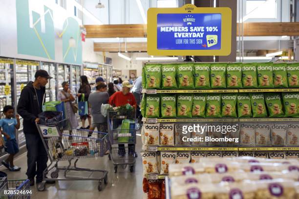 Customers shop during the grand opening of a Whole Foods Market 365 location in Santa Monica, California, U.S., on Wednesday, Aug. 9, 2017. The fifth...