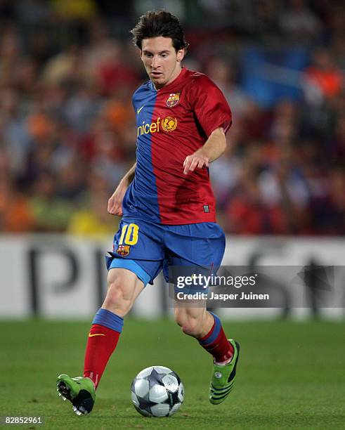 Lionel Messi of Barcelona runs with the ball during the UEFA Champions League Group C match between Barcelona and Sporting Lisbon at the Camp Nou...