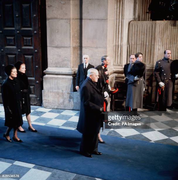 Randolph Churchill with his mother Lady Churchill, followed by Christopher Soames and Sarah Lady Audley arrive at St Pauls Cathedral for the funeral...