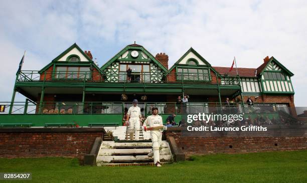 Paul Horton and Mark Chilton of Lancashire walk out to bat in front of the old pavilion at start of play during the LV County Championship Match...
