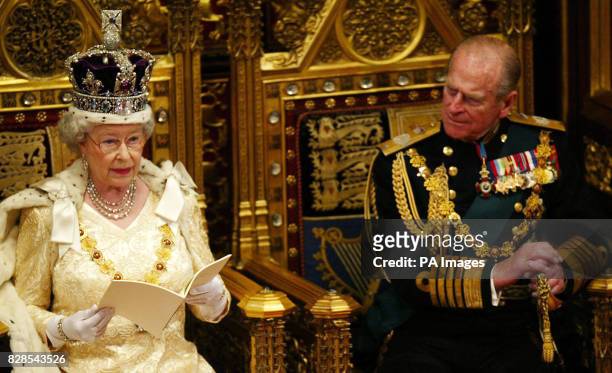 Queen Elizabeth II delivers the speech at the State Opening of Parliament in the House of Lords while the Duke of Edinburgh watches in Parliament in...