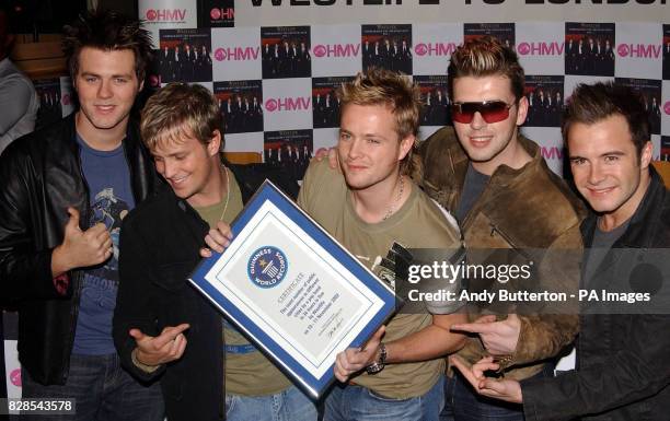 Pop band Westlife launch their new album 'Unbreakable' at HMV, Trocedero in London and receive the world record for the most public appearances in...