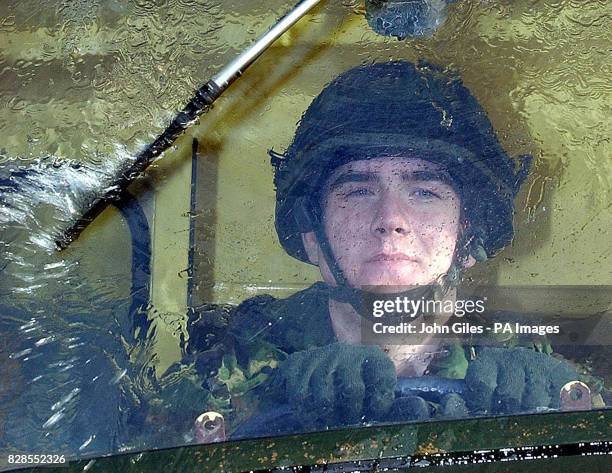 Member of the Light Dragoons Regiment from Cleveland in a Green Goddess on the streets of Middlesborough, providing cover on the first day of the...