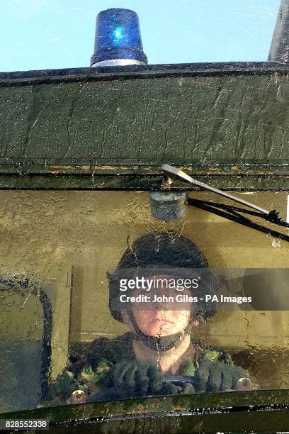 Member of the Light Dragoons Regiment from Cleveland in a Green Goddess on the streets of Middlesborough, providing cover on the first day of the...