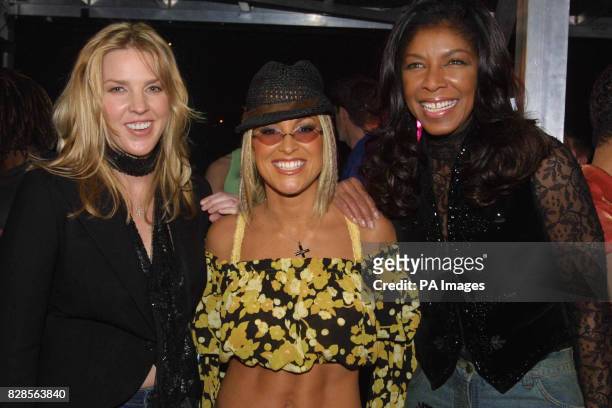 American singers : Diana Krall, Anastacia, and Natalie Cole pose for the cameras after the Royal Variety Performance attended by the Prince of Wales....