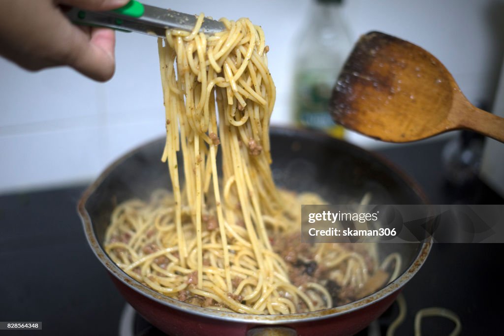 Boiled water and spaghetti noodle for cooking italian pasta