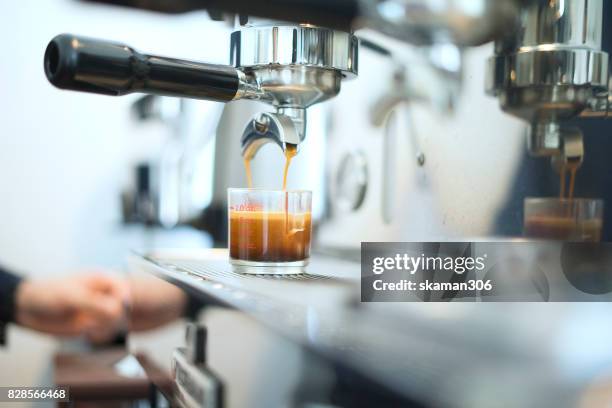 morning coffee with italian espresso shot with coffee maker machine and espresso shot - espressomachine stockfoto's en -beelden