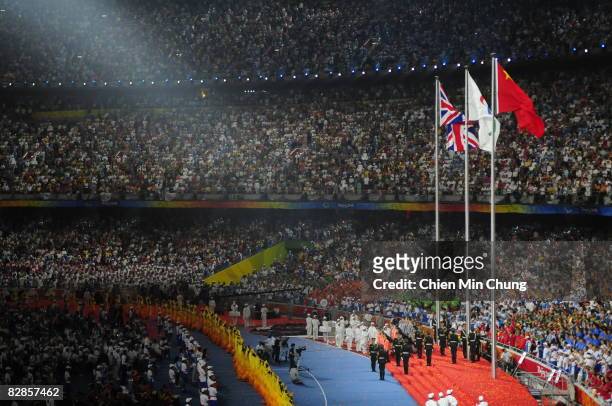 The British flag is raised for the handoff for the 2012 Paralympics during the 2008 Paralympics Closing Ceremony at National Stadium during day...