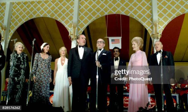 President Richard Nixon and composer Irving Berlin sing as they perform onstage at a Vietnam POW dinner at the White House, Washington DC, May 24,...