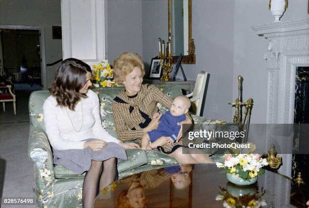 Portrait of Margaret Trudeau, the wife of Canadian Prime Minister Trudeau, as she smiles at her infant son, future Canadian Prime Minister Justin...