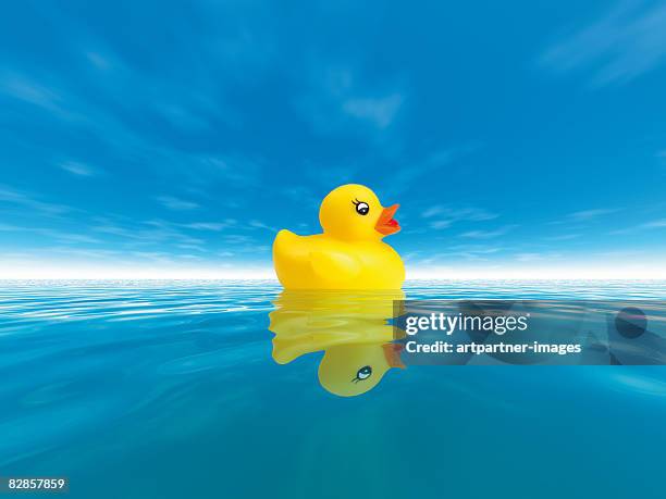 swimming duck in the clear blue sea  - rubber duck stock illustrations