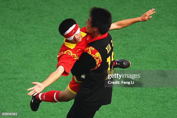 Wang Yafeng and Dong Junjie of China celebrates a goal in the Five-A-Side Football match between China and Brazil at Olympic Green Hockey Field B...