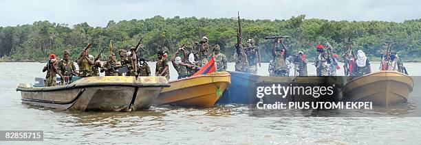 Fighters with the Movement for the Emancipation of the Niger Delta prepare to head off for an operation against the Nigerian army in the Niger Delta...