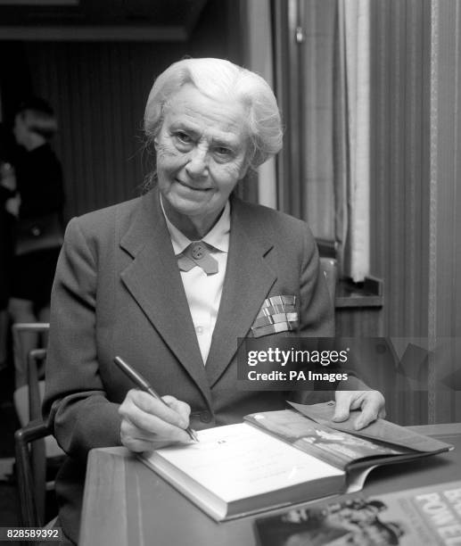 Lady Olave Baden-Powell autographing a copy of her biography at Hodder and Stoughton's in London to mark its publication. The book is an inspiring...