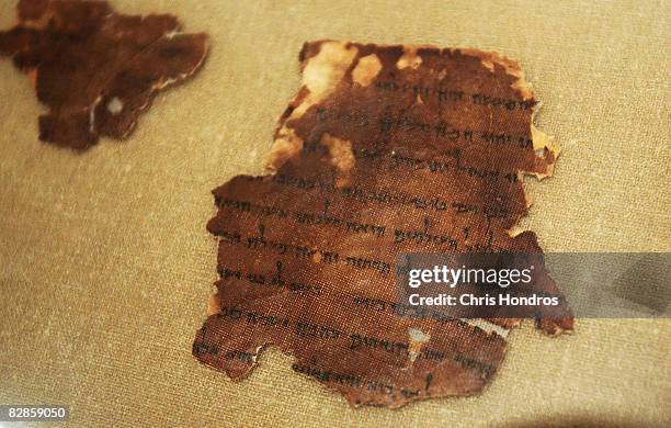 Two thousand-year-old fragment of the The Book of Tobit from the Dead Sea Scrolls is seen on display at The Jewish Museum September 17, 2008 in New...