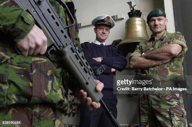 Commanding Officer of HMS Ocean, Captain Adrian Johns and the Commanding Officer of 40 Commando, Lt Colonel Gordon Messenger, stand at the top of the...