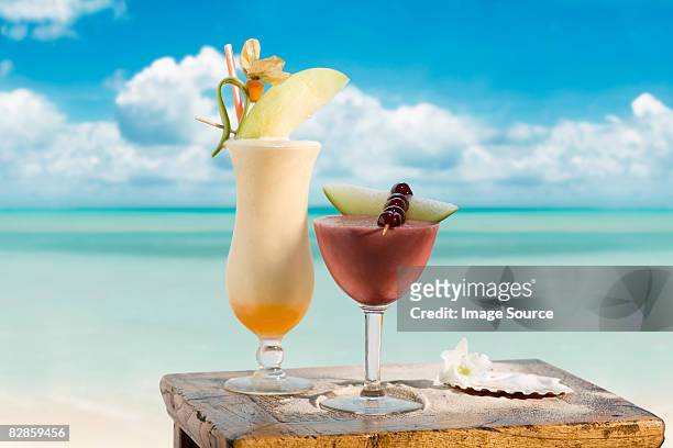 pina colada and strawberry margarita - cocktails beach stock pictures, royalty-free photos & images