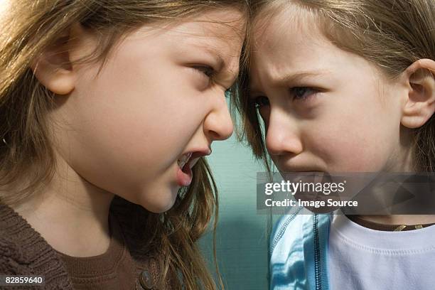 sisters fighting - siblings arguing stock pictures, royalty-free photos & images