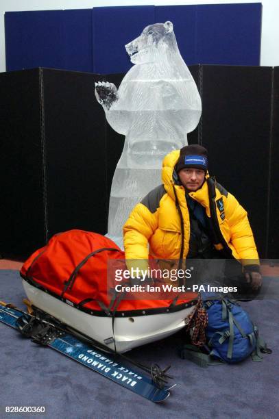 Jim McNeill, dressed in full polar suit and flanked by a 7'foot ice sculpture of a Polar Bear, during a photocall at the Natural History Museum,...