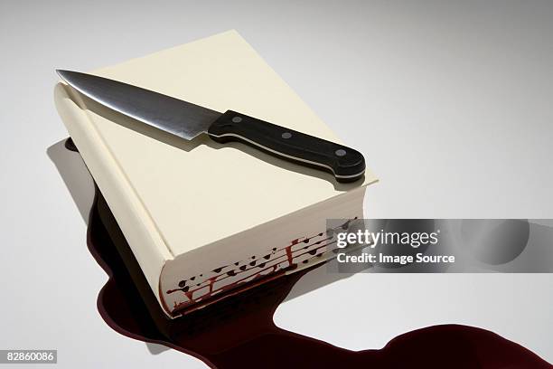 a book with blood dripping out of it - mystery book stock pictures, royalty-free photos & images