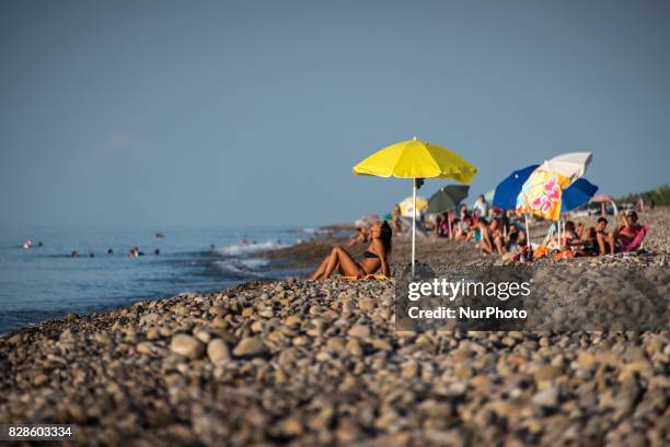 Vacationers enjoying the beach in Caronia, Sicily, Italy on 6 August 2015.