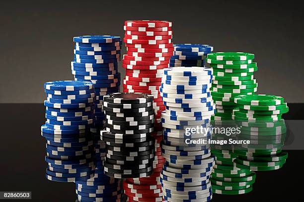 stacks of gambling chips - gambling chip stock pictures, royalty-free photos & images