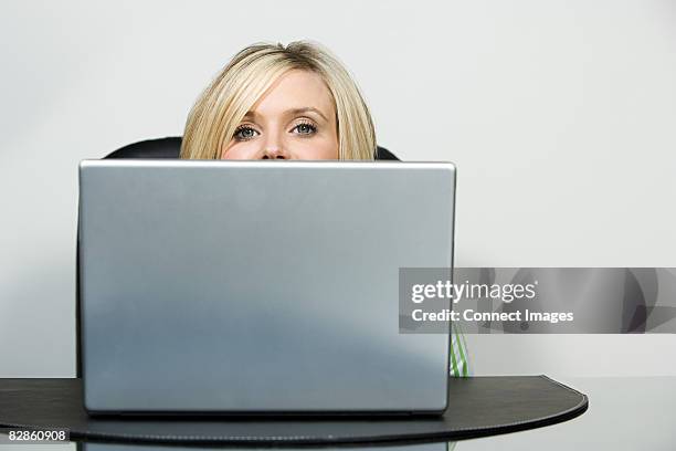 Woman Head Over Computer Screen 22 Peeking Over Laptop Stock Photos, High-Res Pictures, and Images ...
