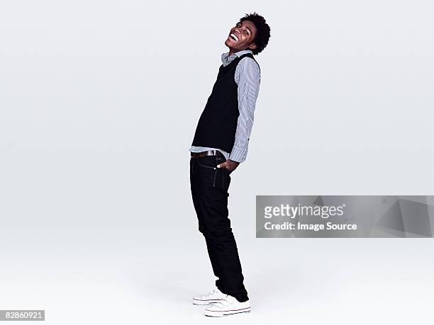young man laughing - full length stock pictures, royalty-free photos & images