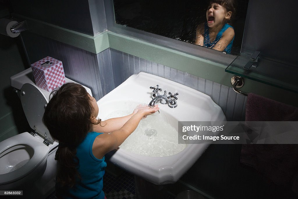 Girl splashing water