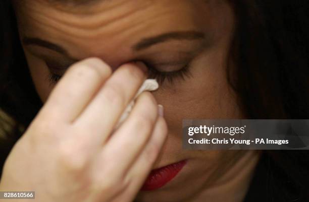 Theresia Muller, the sister of the murdered artist Margaret Muller weeps during a press conference at Bethnal Green Police Station in East London at...