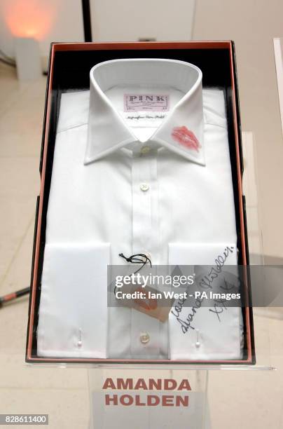 Shirt kissed and signed by actress Amanda Holden at the Lipstick on you Collar auction for the Haven Trust at The Avenue, St James's Street in London...