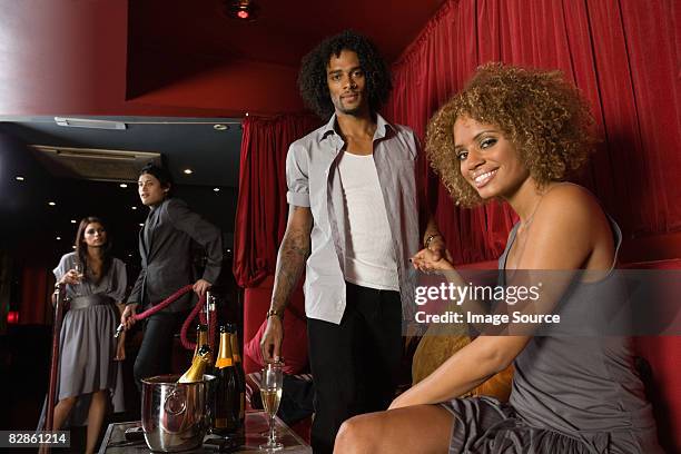 a couple in a vip area of a nightclub - vip bar stock pictures, royalty-free photos & images