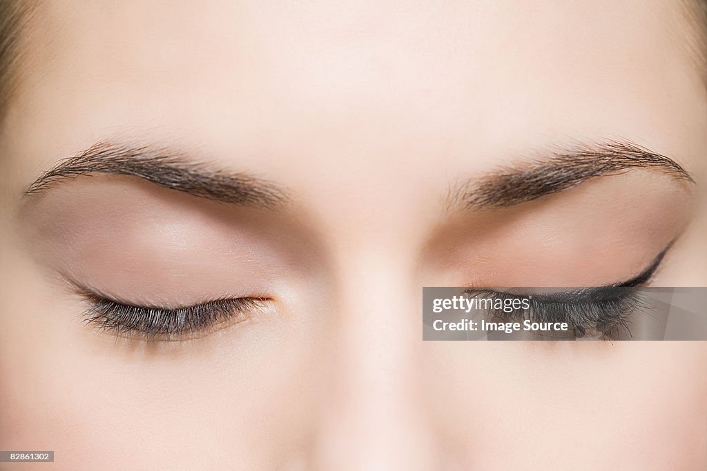 Woman with eyes closed
