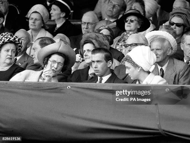 The acknowledged expert of the family, Princess Marina, Duchess of Kent, explains a tricky tennis point to her son, Prince Michael, and daughter...